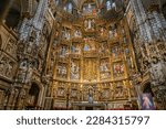 Small photo of Toledo, Spain - April 29, 2022 - Sparkling gold reliefs of what is called the “Retablo” in the Capilla Mayor, the Main Chapel High Altar in the Toledo, Spain Cathedral.