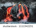 Small photo of Hawaii lava flow entering the ocean on Big Island from Kilauea volcano. Volcanic eruption fissure view from water. Red molten lava.