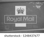 Small photo of CAMBRIDGE, UK - CIRCA OCTOBER 2018: Sign on red Royal Mail van in black and white