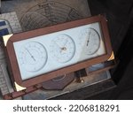 Small photo of PARIS, FRANCE - CIRCA SEPTEMBER 2022: Altitude hygrometer barometer and thermometer combo weather measuring instrument