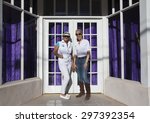 Small photo of Bisbee, Arizona, USA, April 6, 2015, Phylis Tampio and Leslie Plimpton pose in front of purple draped doorway
