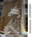 Small photo of confectionery figure head of a white Basilisk close-up