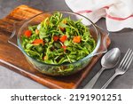 Small photo of Purslane salad with tomatoes in a glass bowl. Healthy eating concept