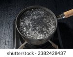 Boil water in an iron pot