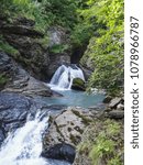 Small photo of waterfall in the Swiss mountains Rosenlaui Valley Switzerland