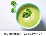 Green soup. Zucchini, spinach cream soup with cream.