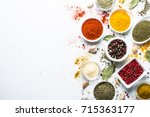 Set of various spices in a bowls on white background. Top view copy space.