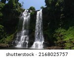 Small photo of Dual waterfall amid dramatic scenery. Tad Yuang Waterfall the natural attraction of the Bolaven Plateau, Paksong District, Champasak Province, Laos.