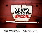 Old Ways Won't Open New Doors. Motivational quote. Innovation and creativity concept written on a grunge iron signboard