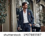 Handsome male model in checked suit walking on the street